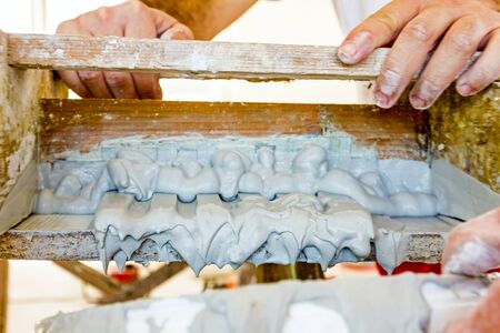 Craftsmen made plaster moldings on the traditional methodの写真素材