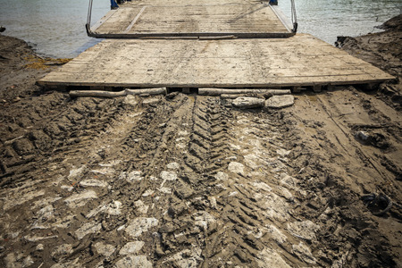 Beached old ferry is ready to load vehicles and passengers to cross the river.の写真素材