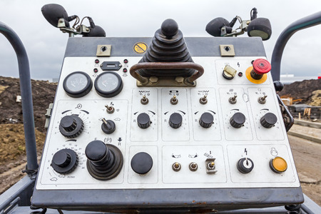 Control panel of a tarmac road laying machine, industrial machinery.