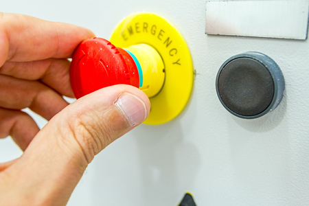 Hand is operating a heavy duty switch on electrical cabinet providing electrical energy to...
