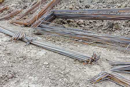 Steel bars stacked for construction, classified by the bending shape at construction site.