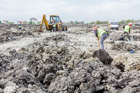 Zrenjanin, Vojvodina, Serbia - June 14, 2015: Backhoe tractor is working on a construction site....