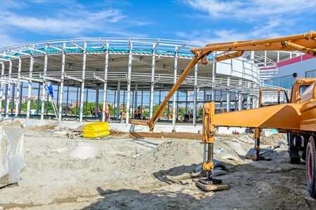 Crane's arm of mechanical pump for concrete transport over pipeline.の写真素材