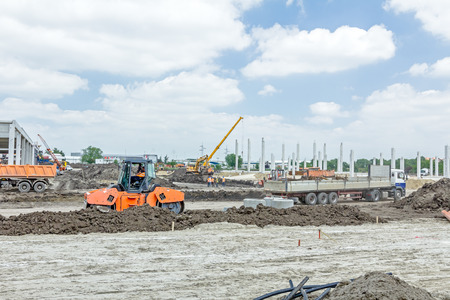 Landscape transform into large urban area, concrete hall, people at work.の写真素材