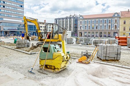 Vibration plate compactor is at construction site in the city street.のeditorial素材