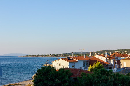 Landscape of a beautiful settlement next to the open blue sea.の写真素材