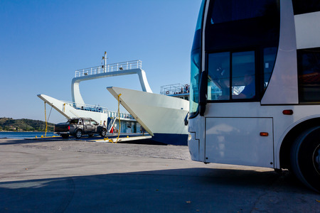 Large ferryboat has opened his front gate for boarding busses and other vehicles at the local port.の写真素材