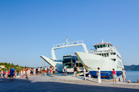 Pefki, Island Evia, Greece - 11, July 2017: Anchored large ferryboat has opened his front entrance for unloading vehicles at the local harborのeditorial素材