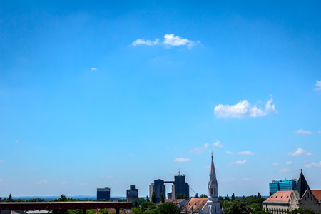 Urban landscape, city buildings with ceramic roofs and industrial complex placed in distance. の写真素材