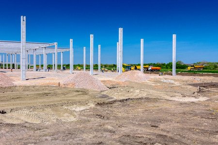 Landscape transform into urban area with machinery, people are working. View on construction site.の写真素材