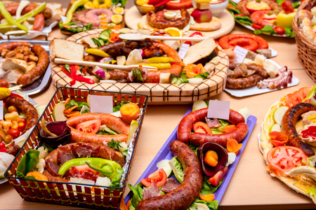 Decorated sausages with fresh vegetables are exposed on traditional sausage tournament.の写真素材