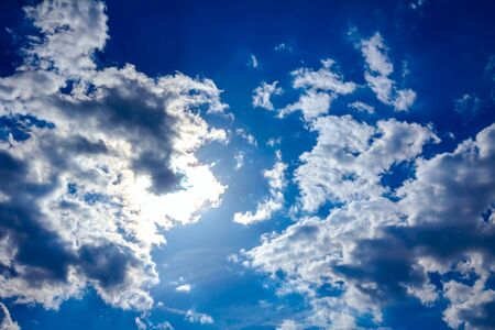The rays of the sun break through the clouds, cumulus cloudscape.