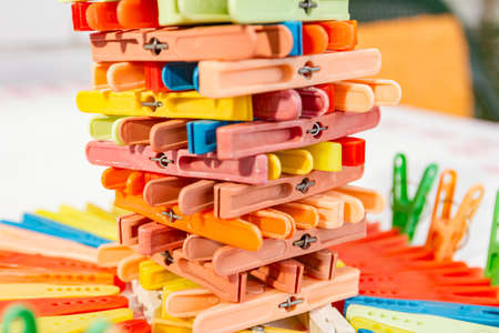 Mother is giving a hand to her daughter with colorful dress.の写真素材