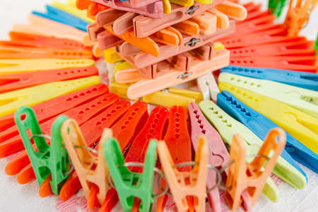 Clothes pegs,  multicolored clothespins are arranged, lined in artistic shape.