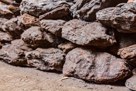Storage of dry wooden coal, charcoal is piled and ready for ussage.