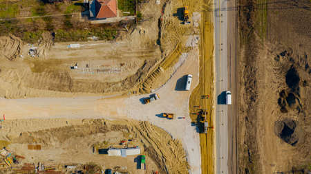 Above top view, overhead on blade leveling machine, grader, until is leveling layer of sand for new...