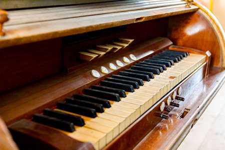 View on obsolete ancient wooden organ keyboard in Roman Catholic Church in Ivanovo.