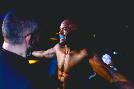 Zrenjanin, Vojvodina, Serbia October 16, 2021: MMA XXXVI SBC Tournament Judge taking last review of MMA competitor, fighter before it enters in arena, ring octagon, for fight in fights without rules.のeditorial素材