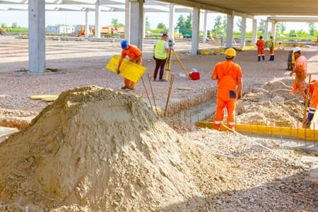 Preparation is in progress to assembly wooden mold for concrete pouring.