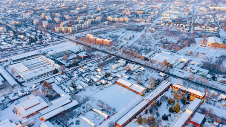 Aerial view is on the roofs of houses white of snow, frosty cityscape in the winter time.の写真素材