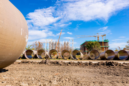 Many concrete pipes with durable ceramic glaze and large diameter for chemical waste are stacked waiting to built-in.の写真素材