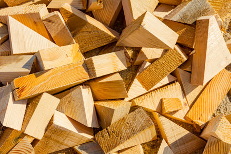 Large pile of pieces cut wood with various forms, waste of chopped tree.の写真素材