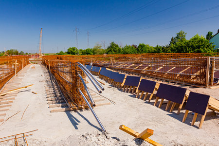 Steel pipes for introducing cables pulled through quadratic reinforcement mesh placed for strength...