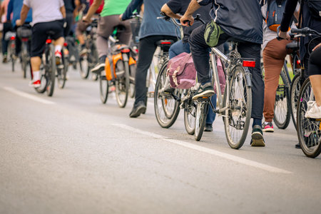 Group of young people cycling, ride bicycles in city, they try to draw attention to the danger for...