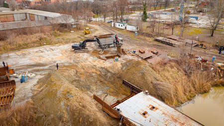 Above view on excavator and tow grapple truck with hydraulic grappling claw, multivalve grab hand,...