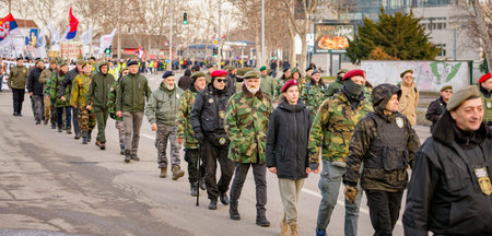 Zrenjanin, Serbia - January 25, 2026: Group of war veterans with berets at student's protest against government corruption, regime, demand justice for 16 lives lost in tragic accident roof collapseのeditorial素材
