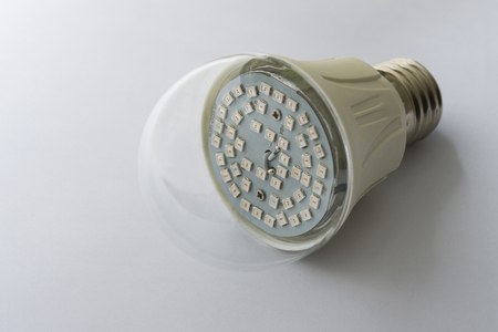 Led lamp with cap close-up. The lamp visible LEDs square shape.  The background of the image is white.の写真素材