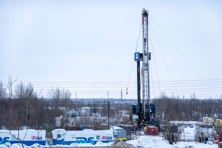 Nefteyugansk, Russia, January 6, 2020: oil well repair in winter. Mobile drilling rig and temporary base around it.のeditorial素材