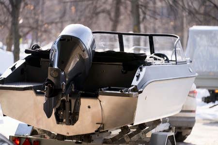 Transportation of a motor boat by passenger car using a trailer. Selective focus.の写真素材