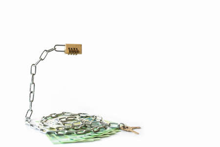 The money is under lock and key. Chains, combination lock and euro on a white background. Copy...
