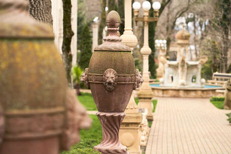 Landscape architecture and design. An alley in the old park, decorated with antique sculptures. Copy space. Selective focus.の写真素材