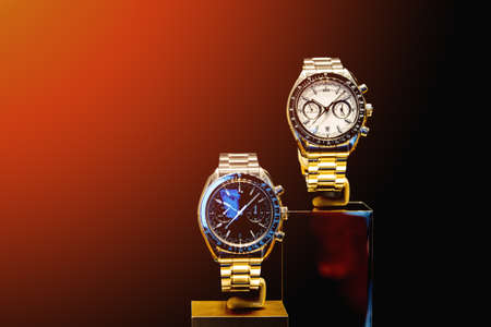 Men's watches in the window on a red and black background. Copy space.の写真素材