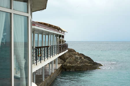 Cafe by the sea on the water on a stylobate. Copy space.の写真素材