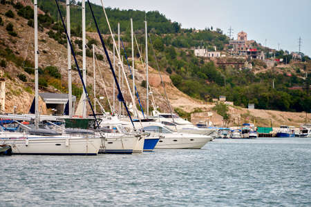Sailing yachts are anchored in the sea harbor. selective focus. copyspace.