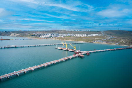Cargo port in the Black Sea-Azov basin. Panoramic view of the shore and sea area with berths. Fragment. Shooting from a drone.の写真素材