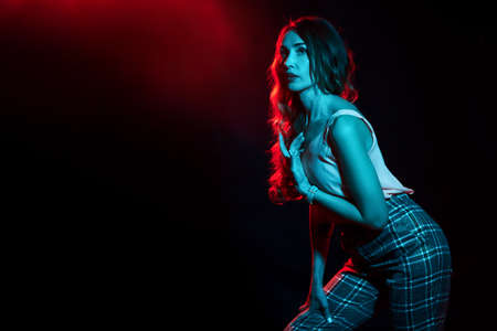 Girl illuminated by a turquoise filterの写真素材