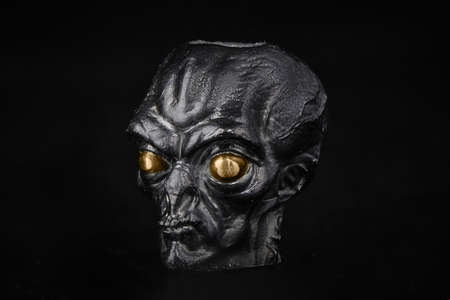 Alien face close up on isolated backgroung. Ufo conceptの写真素材