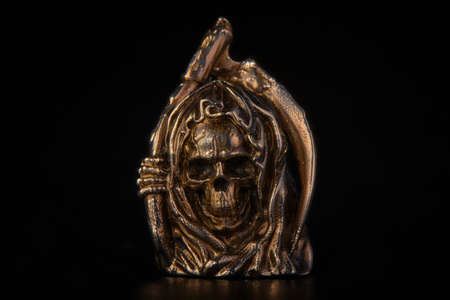 Figure of the grim Reaper with a scythe