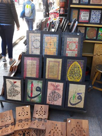 Turkish souvenir shop. Tile with arabic calligraphy. Istanbul, May 2018.のeditorial素材