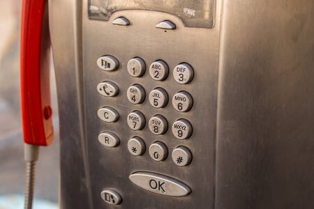 Numeric keypad of an old Italian telephone booth in the cityの写真素材