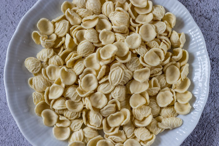 Orecchiette, typical Italian fresh pasta in a white dish.の写真素材
