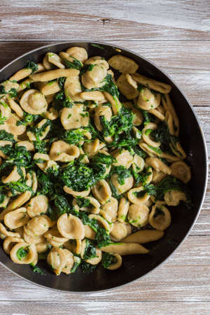 Wholemeal pasta with spinach in a pan. View from top.の写真素材