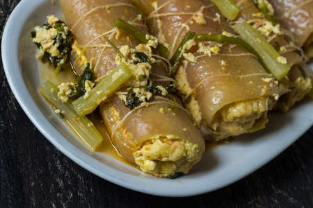Stuffed pork rind. Dish of the ancient peasant tradition. Served in a white dish.の写真素材