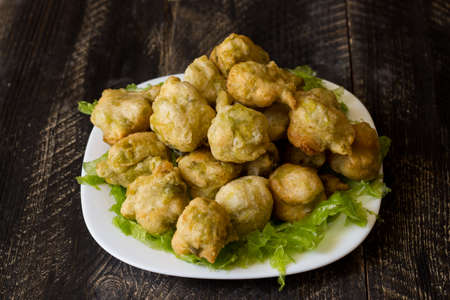 Seaweed fritters, or zeppoline, are small pieces of deep-fried grown dough typical of the Neapolitan tradition.の写真素材