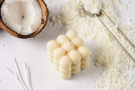 Tools and supply for candle-making: wicks, soy and coconut wax, gold foil, colors and aroma oils, bubble candleの写真素材