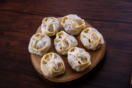 Frozen semi-finished products from dough and meat - manti steamed dishの写真素材